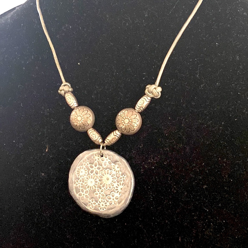 NWOT.  Local Artisan unique Leather and silver floral pendant.